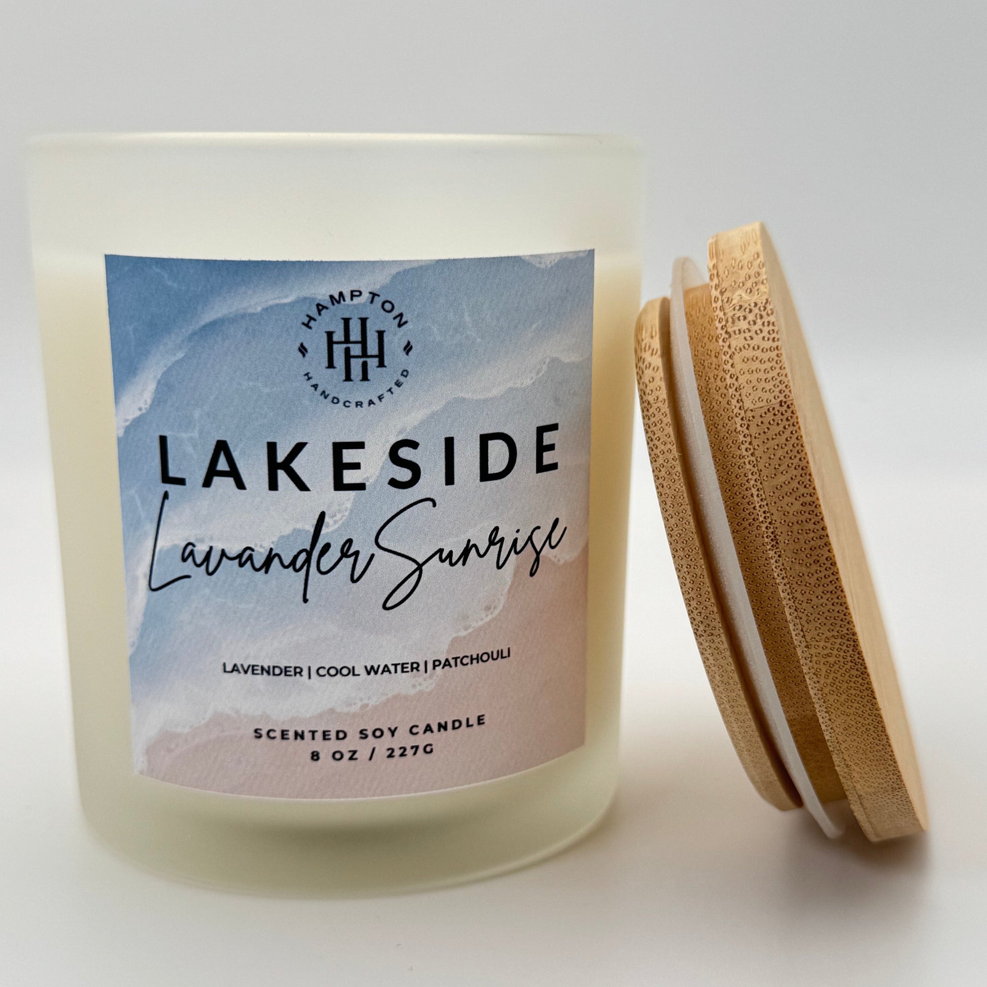 Candle with 'Lakeside Lavender Sunrise' label on a light background