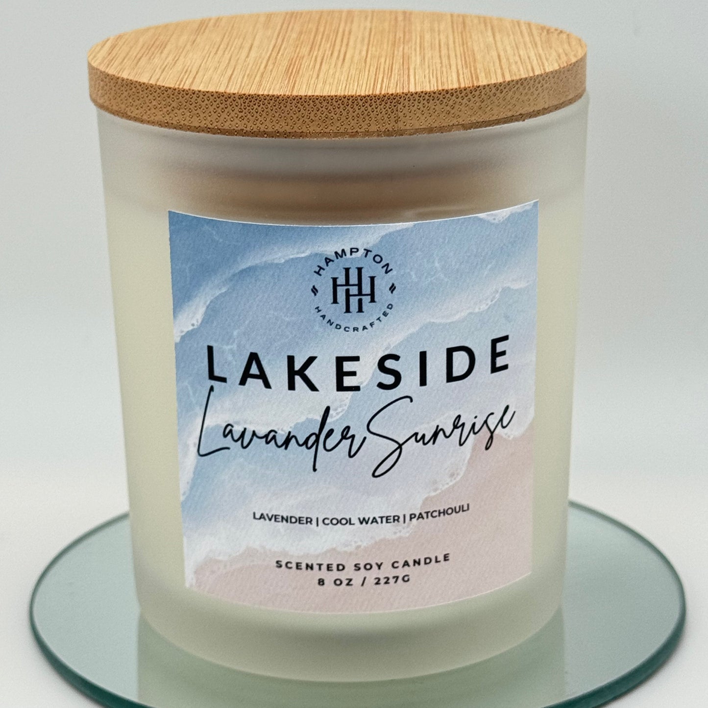 Candle with a label reading 'Lakeside Lavender Scent' on a white background