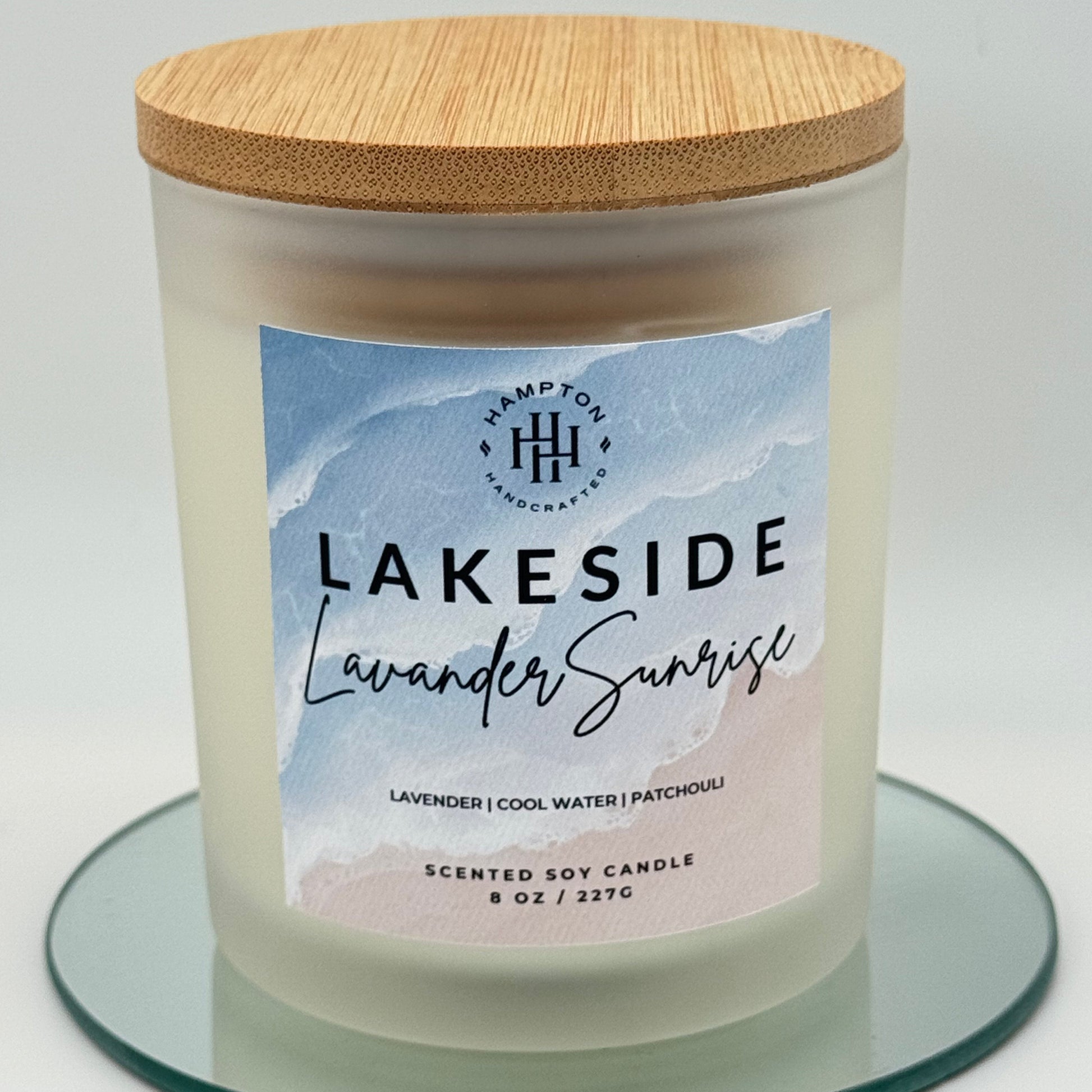Candle with a label reading 'Lakeside Lavender Scent' on a white background